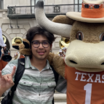 student posing with Bevo, UT Austin mascot